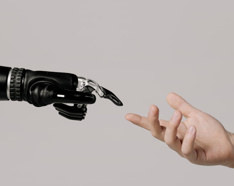 robot hand and human hand